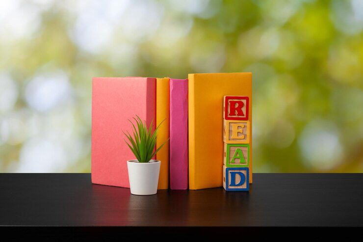 stack books wooden table against blurred background 93675 137326